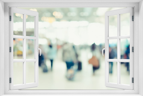 Blurred background,Traveler with baggage at Terminal Departure Check-in at airport with bokeh light,transportation concept.