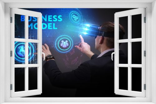 Business, Technology, Internet and network concept. Young businessman working on a virtual screen of the future and sees the inscription: Business model