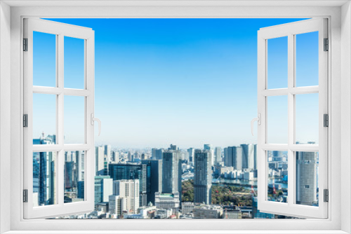Fototapeta Naklejka Na Ścianę Okno 3D - Asia Business concept for real estate and corporate construction - panoramic modern city skyline bird eye aerial view near tokyo tower under bright sun and vivid blue sky in Tokyo, Japan
