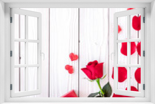 Fototapeta Naklejka Na Ścianę Okno 3D - Prepare the prsesnts or surprise for Valentine's day. Red gift box near red rose and petals on white wooden background top view copy space