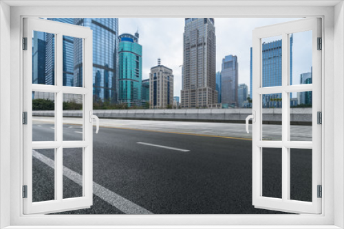 Fototapeta Naklejka Na Ścianę Okno 3D - empty asphalt road with city skyline background in china.