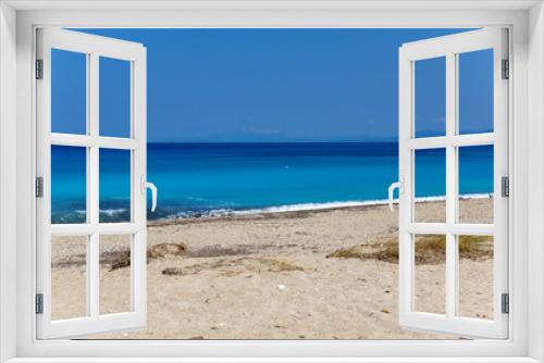 Fototapeta Naklejka Na Ścianę Okno 3D - Panoramic view of Girapetra Beach with blue waters, Lefkada, Ionian Islands, Greece