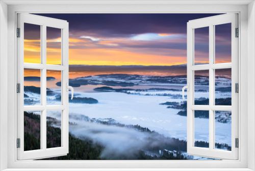 Fototapeta Naklejka Na Ścianę Okno 3D - Grat view of hills and fjords cover in snow during sunset
