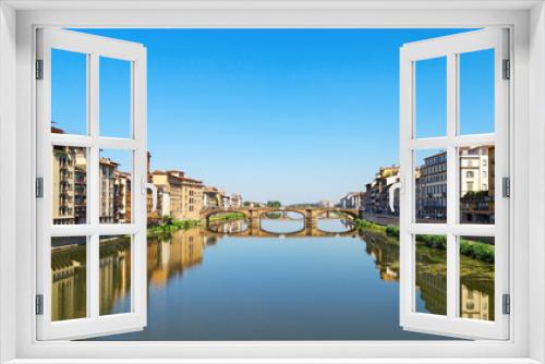 Fototapeta Naklejka Na Ścianę Okno 3D - Bridge over river Arno in city Florence is called Trinity. Stone bridge of Florence, Italy, June 2017. Ponte Santa Trinita.