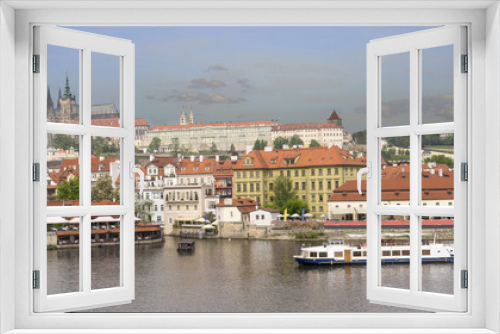 Fototapeta Naklejka Na Ścianę Okno 3D - A boat on Vltava River with Prague castle as background