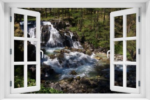 Fototapeta Naklejka Na Ścianę Okno 3D - Wasserfall im Wald mit Sonne in Frankreich