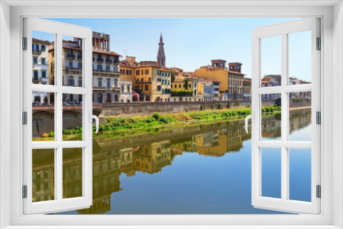Fototapeta Naklejka Na Ścianę Okno 3D - Buildings on the banks of the Arno River in the city of Florence. Italian architecture. Urban landscape in Italy. Reflections on water. June 2017.