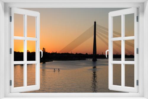 Fototapeta Naklejka Na Ścianę Okno 3D - City river supping at sunset