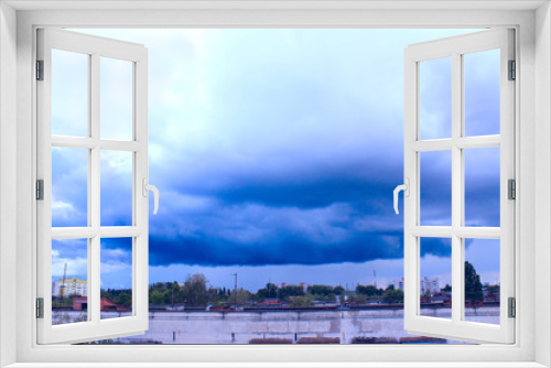 Fototapeta Naklejka Na Ścianę Okno 3D - storm-cloud above the city