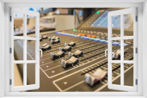 Selective focus buttons equipment for sound mixer control with blurry background., in live studio for broadcasting.