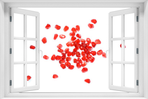 Isolated pomegranate seeds, top view closeup image of scattered pomegranate seeds isolated on white background, red seeds of pomegranate after peeled, tropical fruit healthy food, red fruit grain