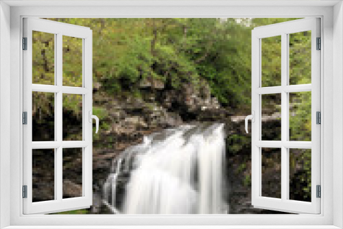 Fototapeta Naklejka Na Ścianę Okno 3D - A waterfall in Scotland near Loch Lomond