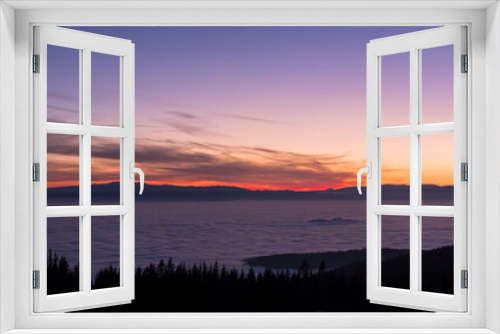 Fototapeta Naklejka Na Ścianę Okno 3D - View from mountain Schoeckl over low stratus to beautiful sunset