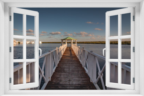 Fototapeta Naklejka Na Ścianę Okno 3D - Wooden Walkway Towards A Romantic Gazebo In The Water