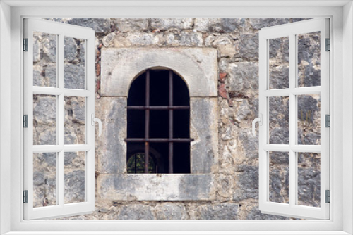 Fototapeta Naklejka Na Ścianę Okno 3D - window with grate in old building in Montenegro