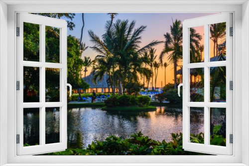 Fototapeta Naklejka Na Ścianę Okno 3D - Multicolored tropical dawn with pond and palm trees, white pelican