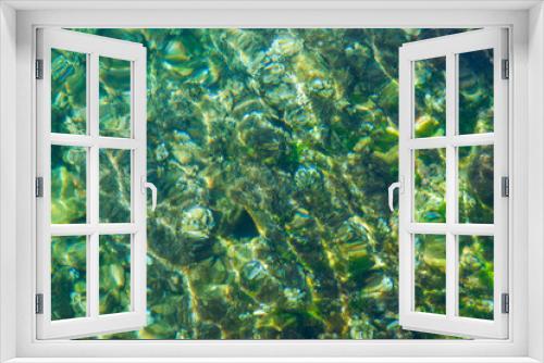 Fototapeta Naklejka Na Ścianę Okno 3D - Stony bottom under greenish transparent water 