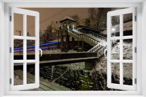 Fototapeta Naklejka Na Ścianę Okno 3D - Light trail of a train at night in winter