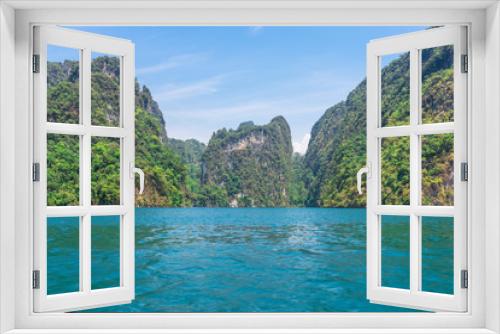 Fototapeta Naklejka Na Ścianę Okno 3D - The national park Khao Sok with the Cheow Lan Lake is the largest area of virgin forest in the south of Thailand. Limestone rocks and jungle and karst formations determine the picture of the Park