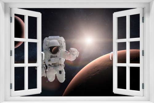 Fototapeta Naklejka Na Ścianę Okno 3D - Astronaut in outer space on background of the Mars. Elements of this image furnished by NASA.