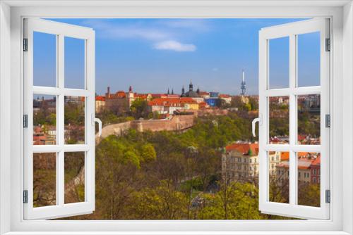 Fototapeta Naklejka Na Ścianę Okno 3D - Prague skyline with wall, castle and living blocks red rooftops with park and trees