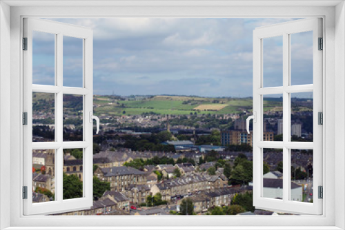 panoramic view of Halifax in west yorkshire with terraced streets buildings and surrounding countryside
