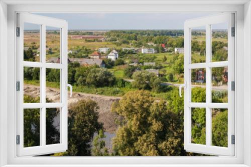 Fototapeta Naklejka Na Ścianę Okno 3D - Aerial view to the suburbs of Pravdinsk (german name of town is Friedland), Kaliningrad Oblast, Russia. The city was founded in 1312 by the Teutonic Knights and located near Kaliningrad.