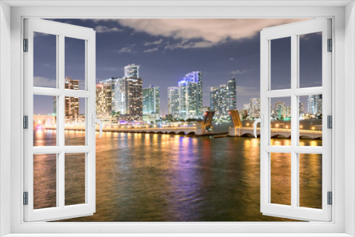 Fototapeta Naklejka Na Ścianę Okno 3D - Miami night skyline from MacArthur Causeway. Buildings reflections