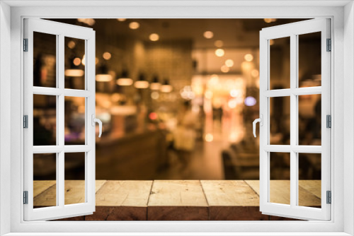 Wood table top (Bar) with blur light bokeh in dark night cafe,restaurant background