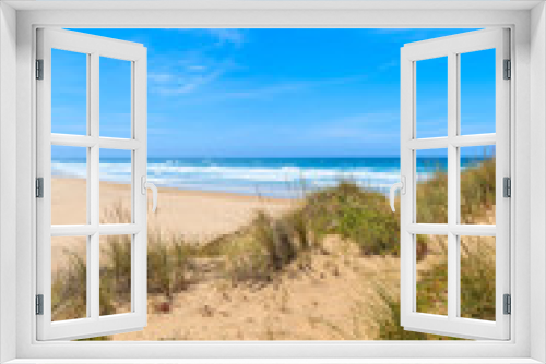 Fototapeta Naklejka Na Ścianę Okno 3D - A view of sandy Castelejo beach from sand dune, famous place for surfing, Algarve region, Portugal