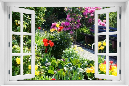 Fototapeta Naklejka Na Ścianę Okno 3D - Gartenanlage mit Tulpen und einer Bank Panorama