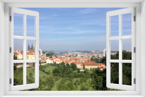 Fototapeta Naklejka Na Ścianę Okno 3D - View of Old Town Prague from a vineyard on a hill in Prague, Czech Republic. Looking down a hill from a vineyard. St Vitus Cathedral and Prague Castle in the background.