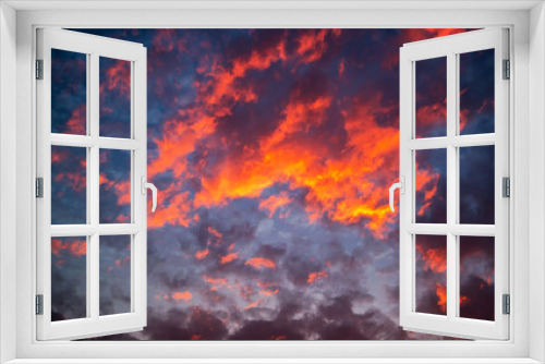 Sunset with dramatic sky and colorful clouds.