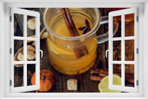 Fototapeta Naklejka Na Ścianę Okno 3D - Vitamin tea with lemon and honey, ginger and spices on wooden background . The concept of spring beriberi and colds.