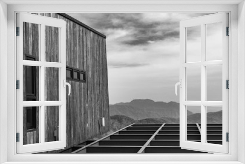 Fototapeta Naklejka Na Ścianę Okno 3D - The black and white modern balcony with landscape mountain and sky in background.