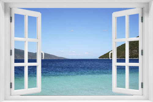 Fototapeta Naklejka Na Ścianę Okno 3D - Bright blue sea and green mountains, sunny summer day at sea