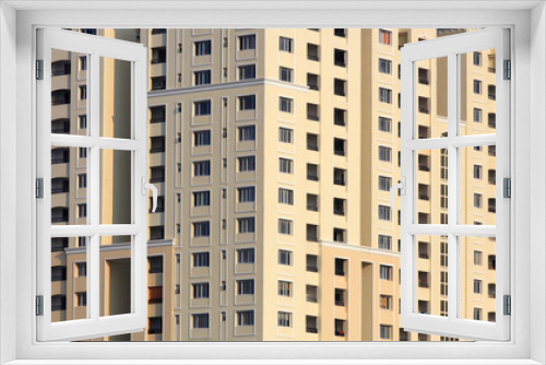 Fototapeta Naklejka Na Ścianę Okno 3D - Close up shot of tall apartment building