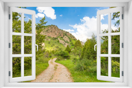 Fototapeta Naklejka Na Ścianę Okno 3D - A dirt road in the Tien Shan mountains in the spring