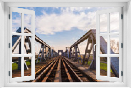 Fototapeta Naklejka Na Ścianę Okno 3D - Old iron railroad bridge in remote rural area in Europe