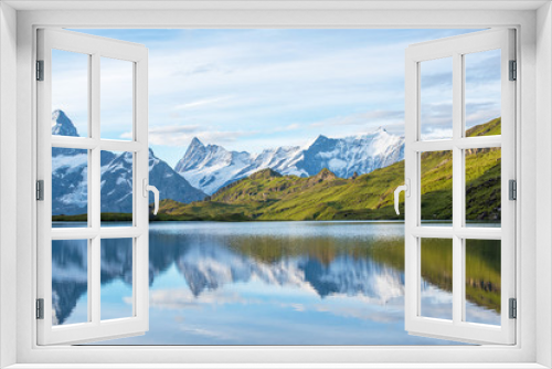 Fototapeta Naklejka Na Ścianę Okno 3D - A magical landscape with a lake in the mountains in the Swiss Alps, Europe. Wetterhorn, Schreckhorn, Finsteraarhorn et Bachsee. ( relaxation, harmony, anti-stress - concept).