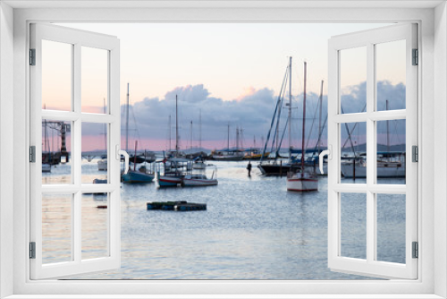 Sunset with Sailboats anchored in the pier