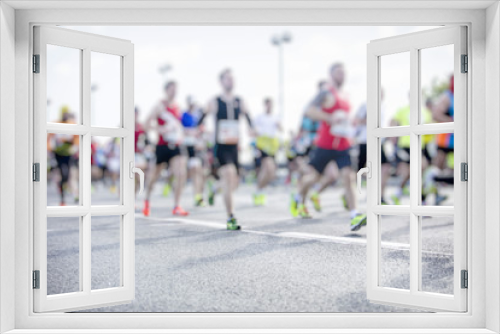 silhouette of people running marathon