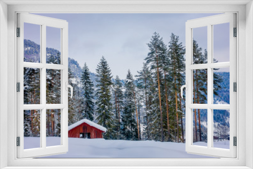 Fototapeta Naklejka Na Ścianę Okno 3D - Astonishing outdoor view of traditional Norwegian mountain red houses of wood covered with snow in the roof in stunning nature background in Norway