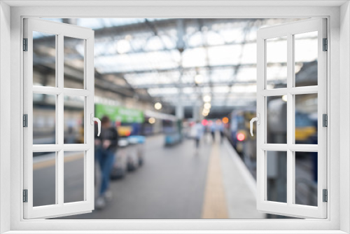 Blurred image bokeh of People walking around Edinburgh Waverley, the main Train Station in Edinburgh, United Kingdom