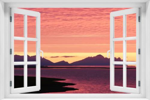 Fototapeta Naklejka Na Ścianę Okno 3D - Incredibly beautiful dawn (sunset) on the shore of the Atlantic Ocean. Silhouettes of mountains and red clouds. Iceland.

