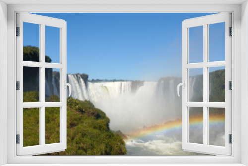 Fototapeta Naklejka Na Ścianę Okno 3D - Iguazu Falls Waterfall with Rainbows and Spray as seen from the Brazil Side.