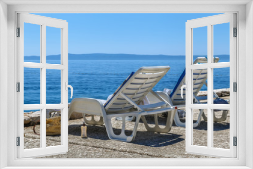 Fototapeta Naklejka Na Ścianę Okno 3D - Deck chair on the beach