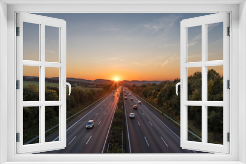 Fototapeta Naklejka Na Ścianę Okno 3D - The road traffic on a motorway at sunset
