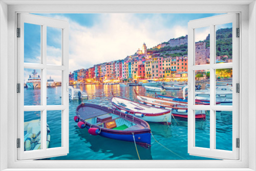 Fototapeta Naklejka Na Ścianę Okno 3D - Mystic landscape of the harbor with colorful houses and the boats in Porto Venero, Italy, Liguria in the evening in the light of lanterns