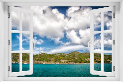 Fototapeta Naklejka Na Ścianę Okno 3D - Holiday destination while travelling and wanderlust. Mountain shore in blue sea on cloudy sky in gustavia, st.barts. Summer vacation on tropical island. Wild nature and environment, ecology
